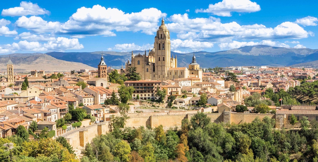 Segovia Cathedral with tourists exploring the historic architecture in Segovia, Spain.