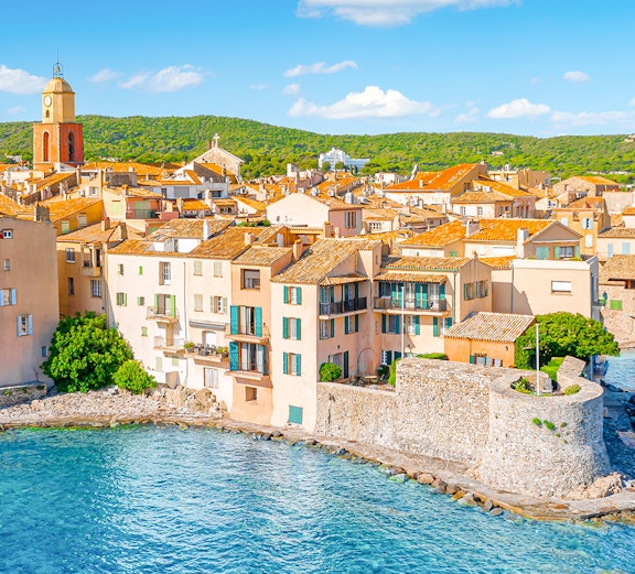 Saint-Tropez waterfront with historic buildings and bell tower, Provence, Cote d'Azur.