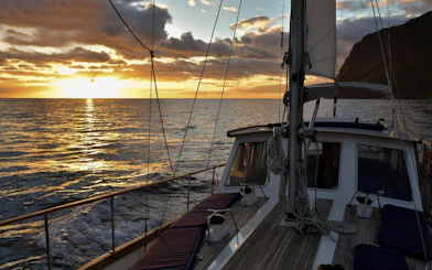Sailing boat at sunset on Madeira Dolphin & Whale Watching tour.