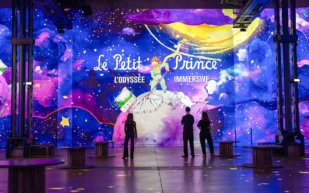 Visitors at the Little Prince exhibition, Atelier Des Lumières, Paris, France.