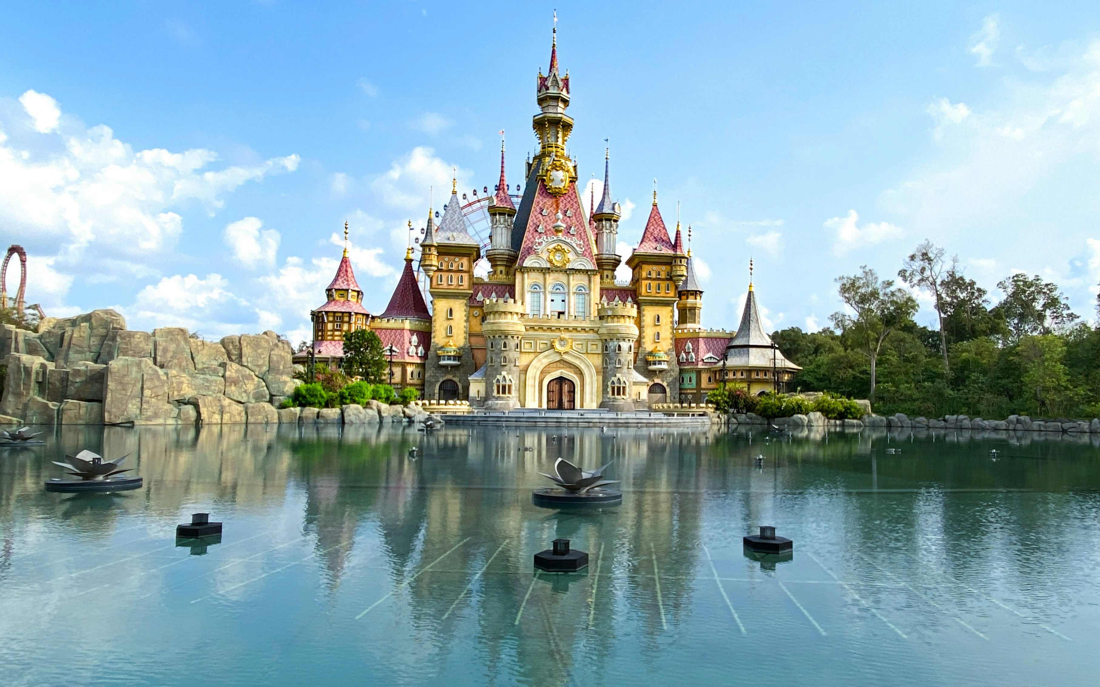 Fairy Castle at VinWonders Phu Quoc reflected in a serene lake.