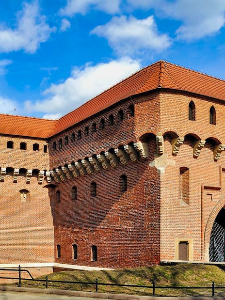 Krakow Barbican with tourists, part of the Combo - Krakow Airport Transfer + Attraction and Museum Pass.