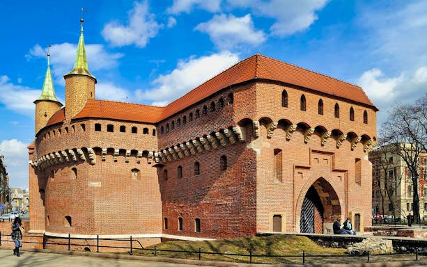Krakow Barbican with tourists, part of the Combo - Krakow Airport Transfer + Attraction and Museum Pass.