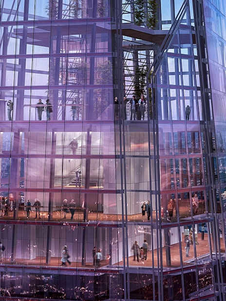 Visitors inside The Shard with panoramic views of London at dusk.