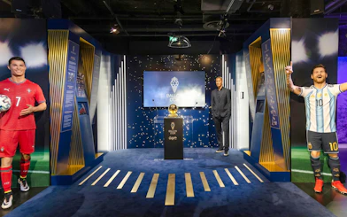 Wax figures of footballers and Ballon d'Or display at Grévin Paris Wax Museum.