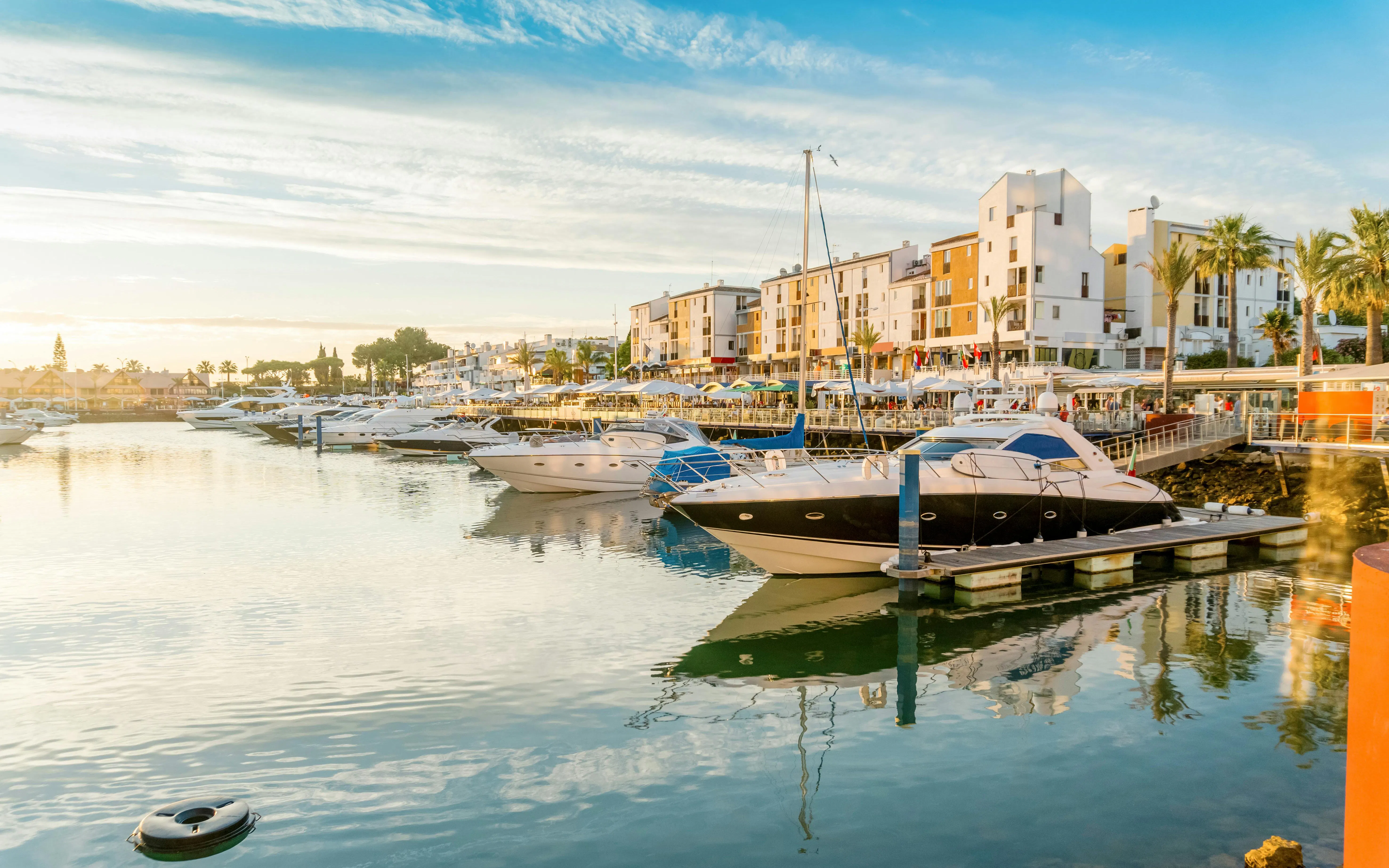 Boats docked at Vilamoura marina in Quarteira, Algarve, Portugal.
