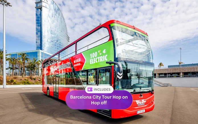 Barcelona hop-on hop-off bus near W Hotel with palm trees in the background.