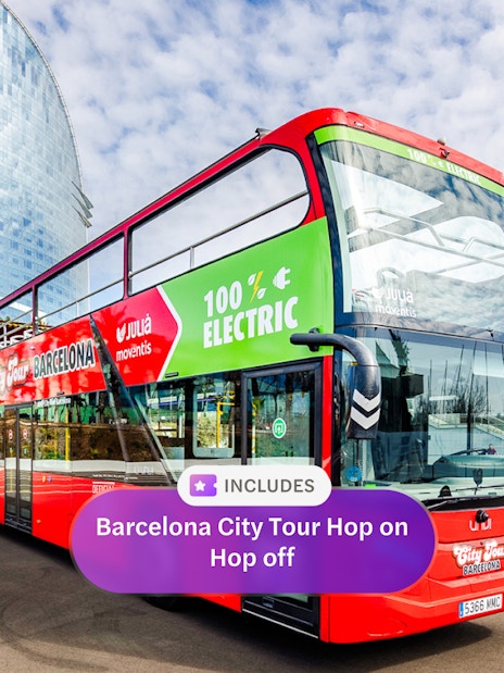 Barcelona hop-on hop-off bus near W Hotel with palm trees in the background.