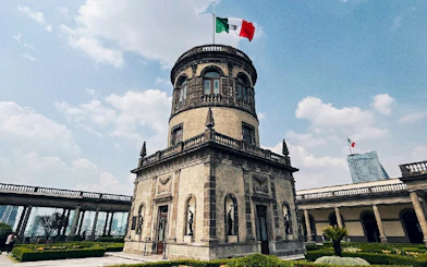 Chapultepec Castle tower with Mexican flag in Mexico City, Mexico.