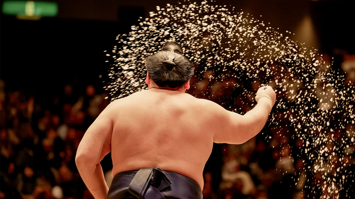 Sumo wrestler performing ritual at Tokyo tournament.