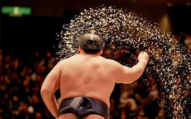 Sumo wrestler performing ritual at Tokyo tournament.