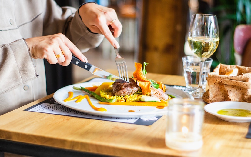 Dining experience near Kew Gardens with gourmet meal and wine.