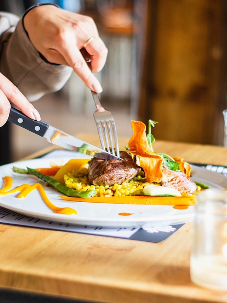 Dining experience near Kew Gardens with gourmet meal and wine.