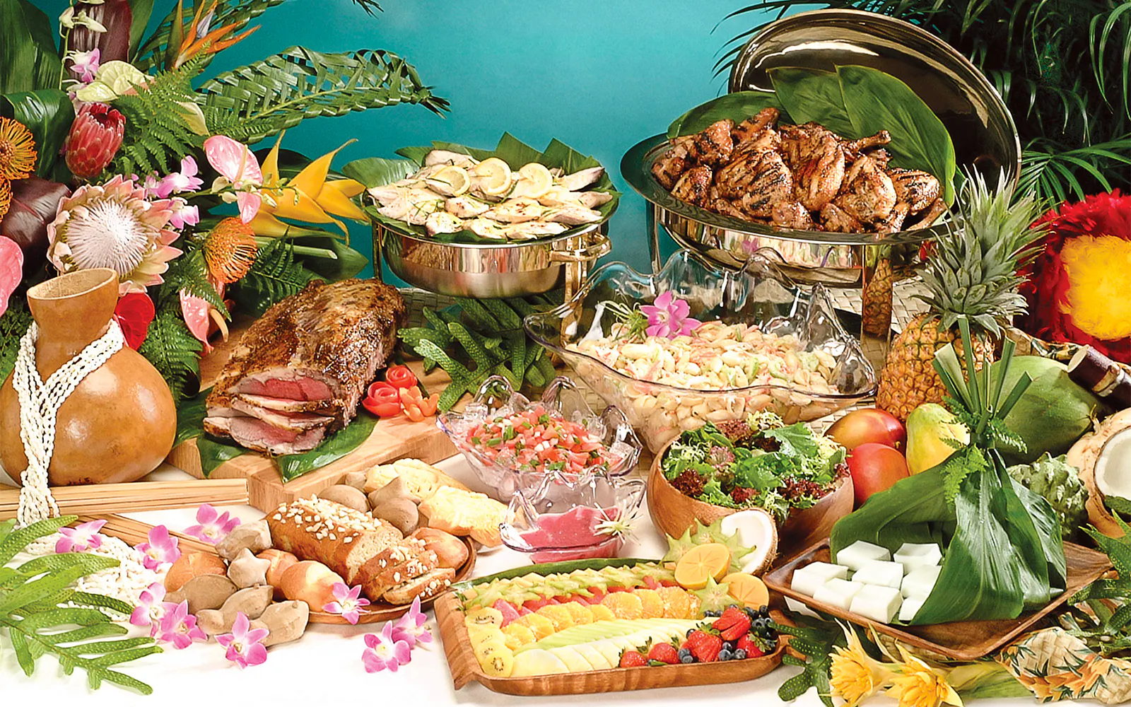 Hawaiian feast with tropical fruits, grilled meats, and salads for Star Independence Day Cruise, Hawaii.