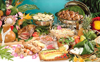 Hawaiian feast with tropical fruits, grilled meats, and salads for Star Independence Day Cruise, Hawaii.