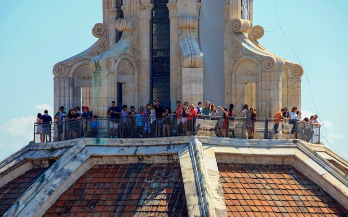 Tourists on Brunelleschi's cupola in Florence enjoying the view.