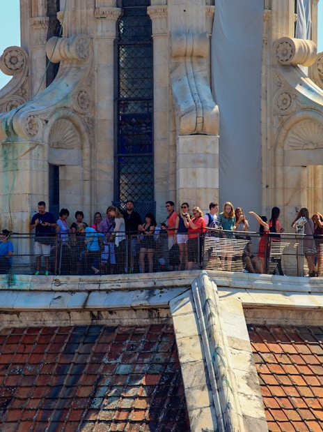 Tourists on Brunelleschi's cupola in Florence enjoying the view.