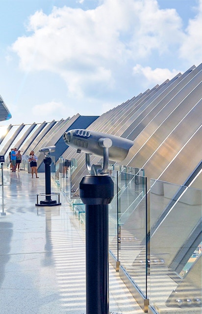 Observation deck with telescopes overlooking Palm Jumeirah, Dubai.