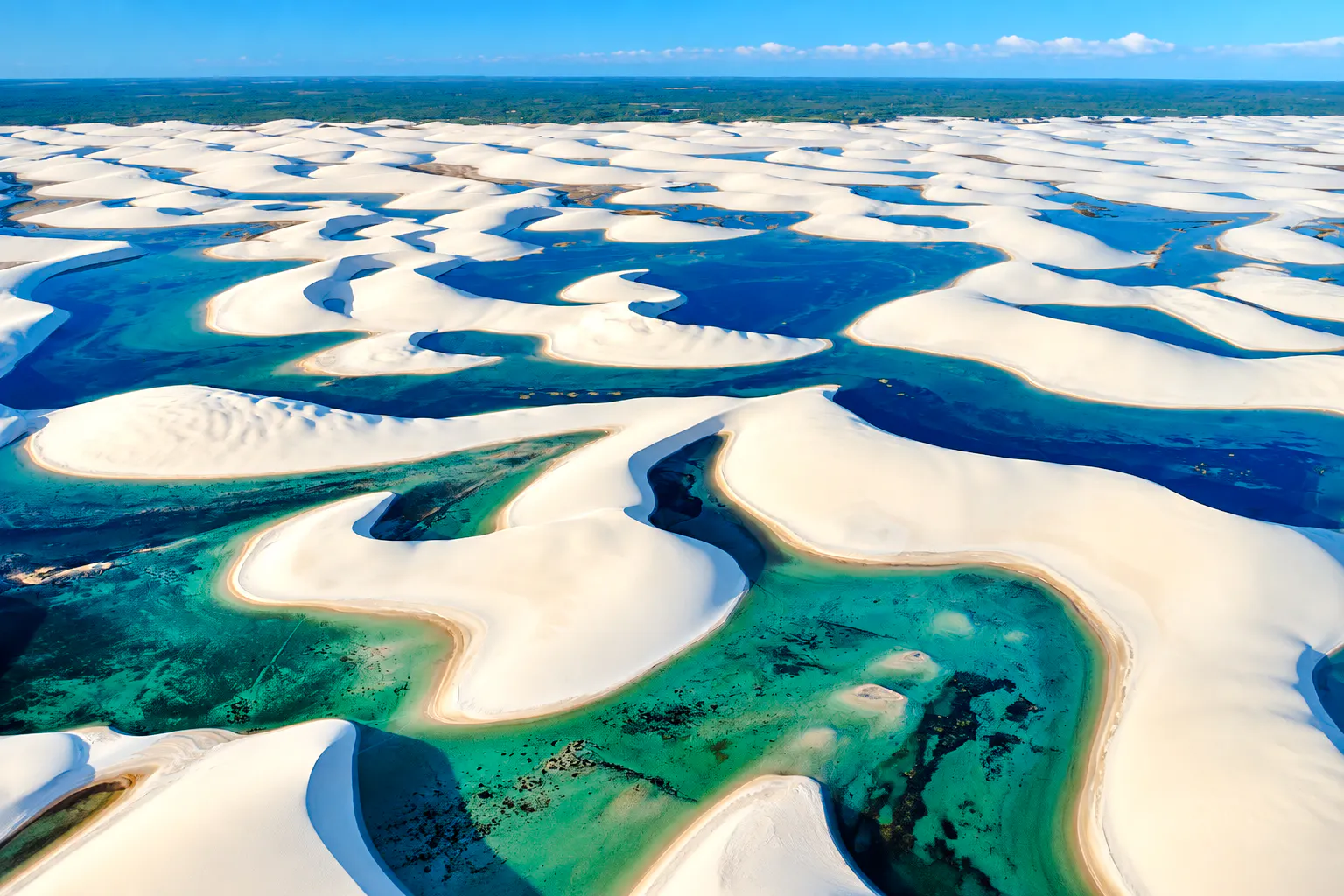 Sand dunes and turquoise lagoons in Barreirinhas, Lagoa Bonita 4x4 Circuit, Brazil.