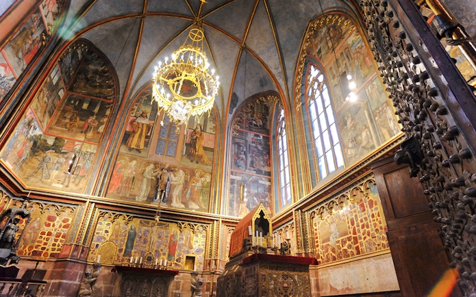 St Wenceslas Chapel interior with ornate frescoes and chandelier, Saint Vitus Cathedral, Prague.