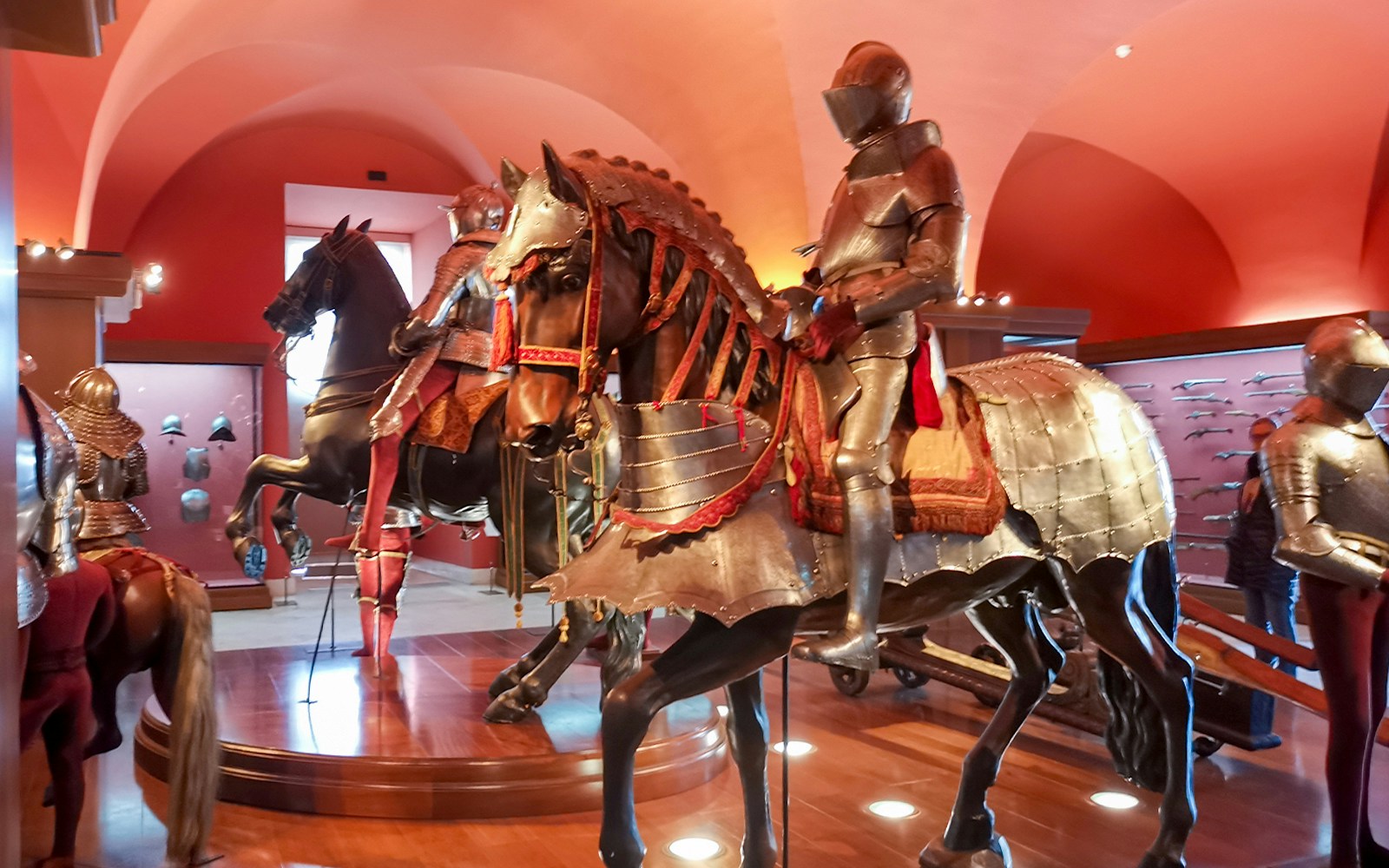 Royal Armoury exhibit with armored knights on horseback, Royal Palace of Madrid.