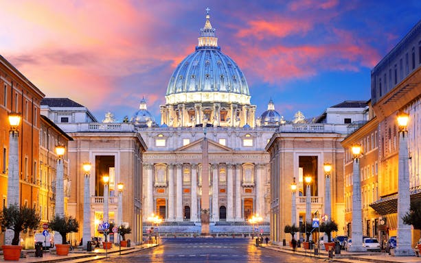 St. Peter's Basilica facade at sunset, Rome.