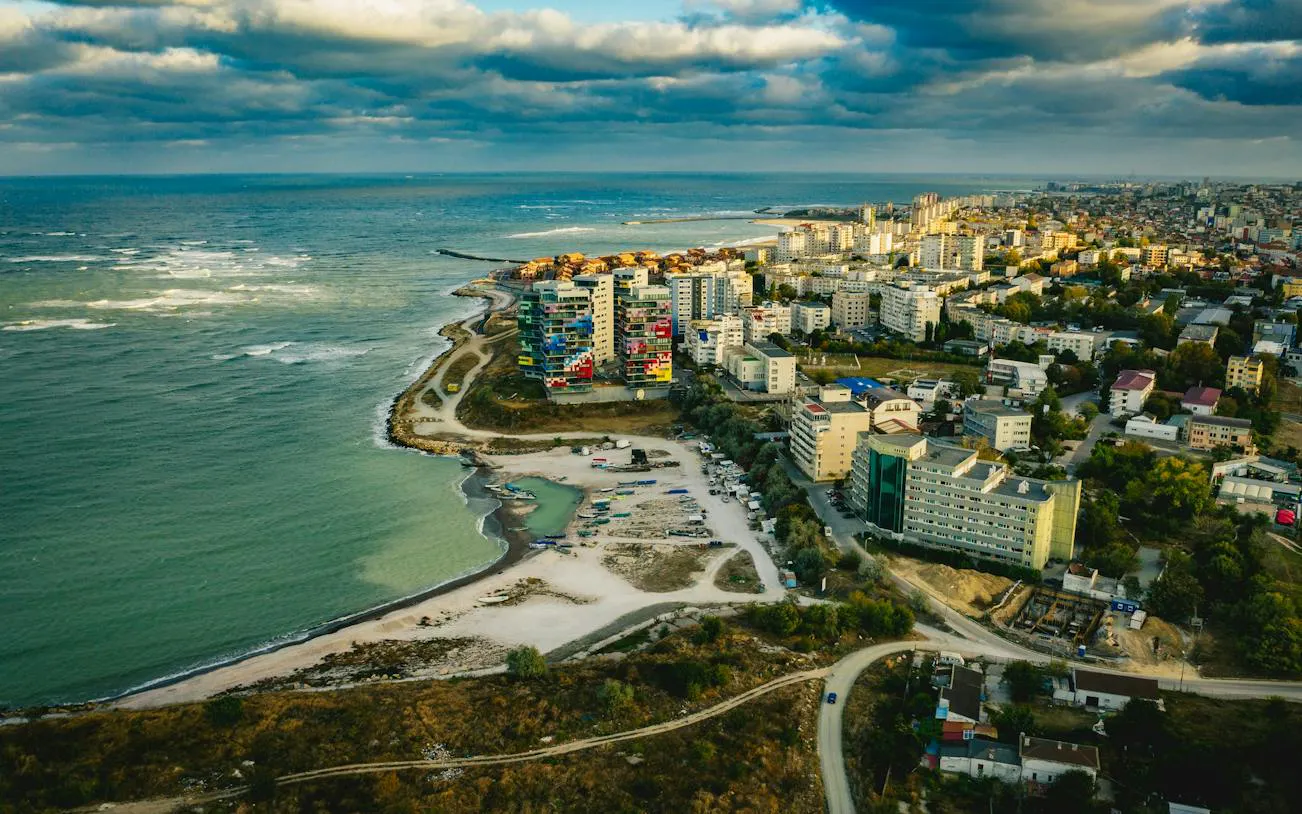 Aerial view of Constanta coastline with colorful buildings near the Black Sea.