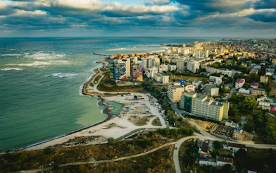 Aerial view of Constanta coastline with colorful buildings near the Black Sea.