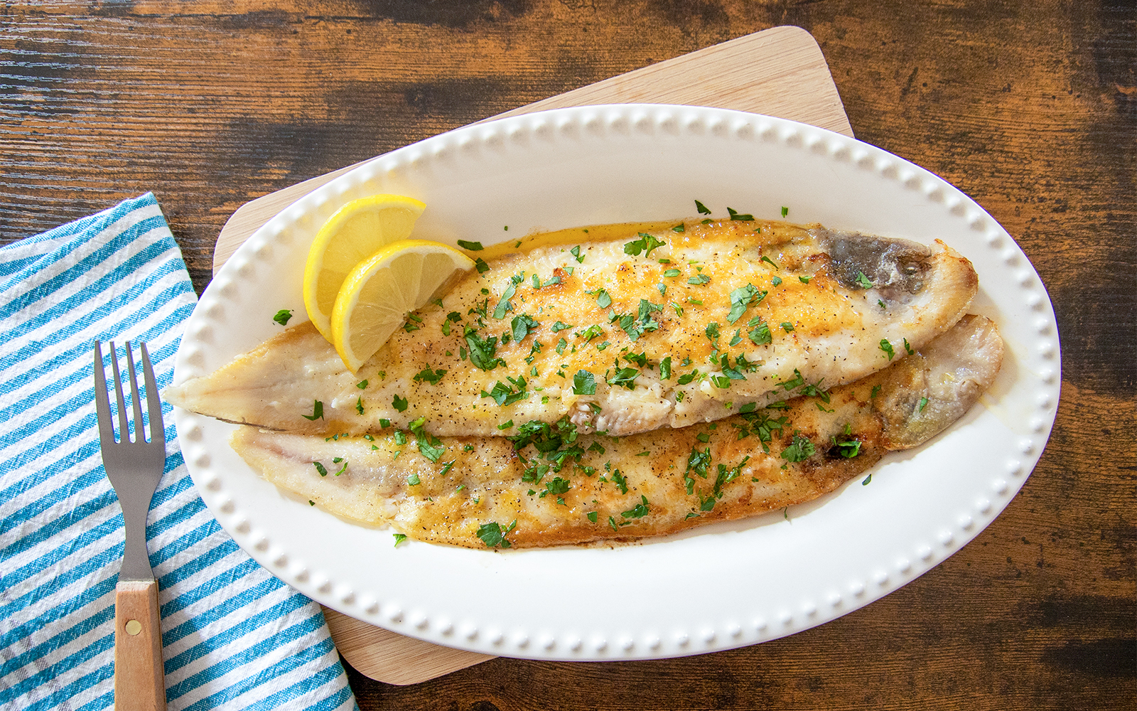 Trout dish with lemon slices served at Medieval Dinner in Prague.