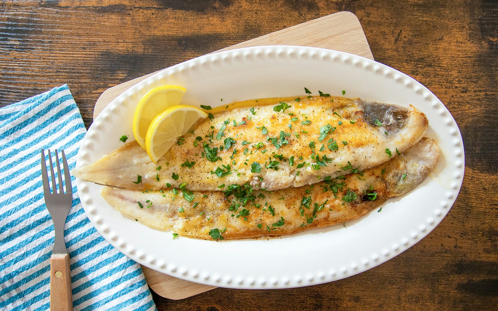 Trout dish with lemon slices served at Medieval Dinner in Prague.