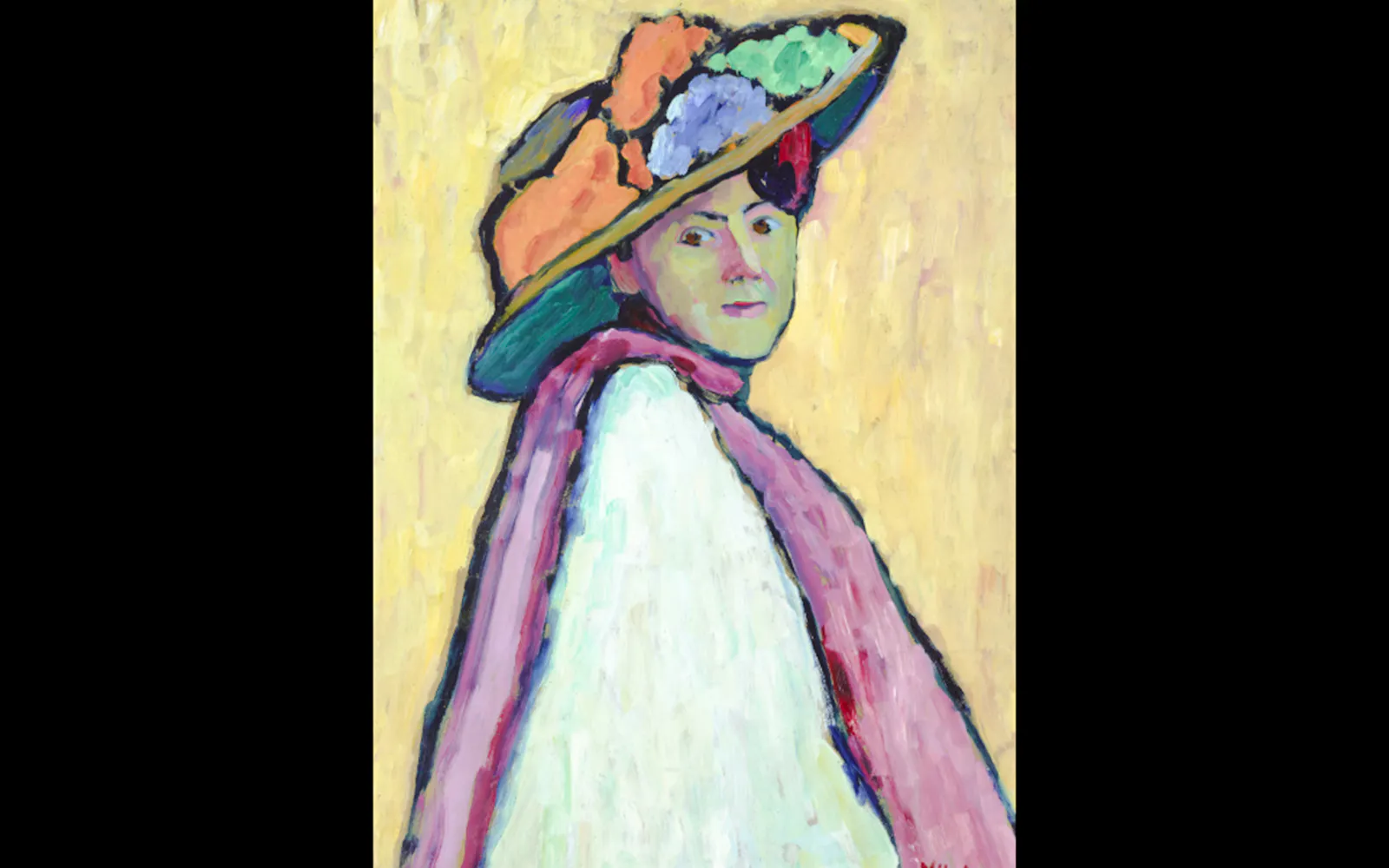 Portrait of a person in a colorful hat and scarf at Museum of Modern Art Paris, France.
