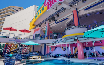 Coco Bongo Beach Party venue with colorful decor and poolside seating.