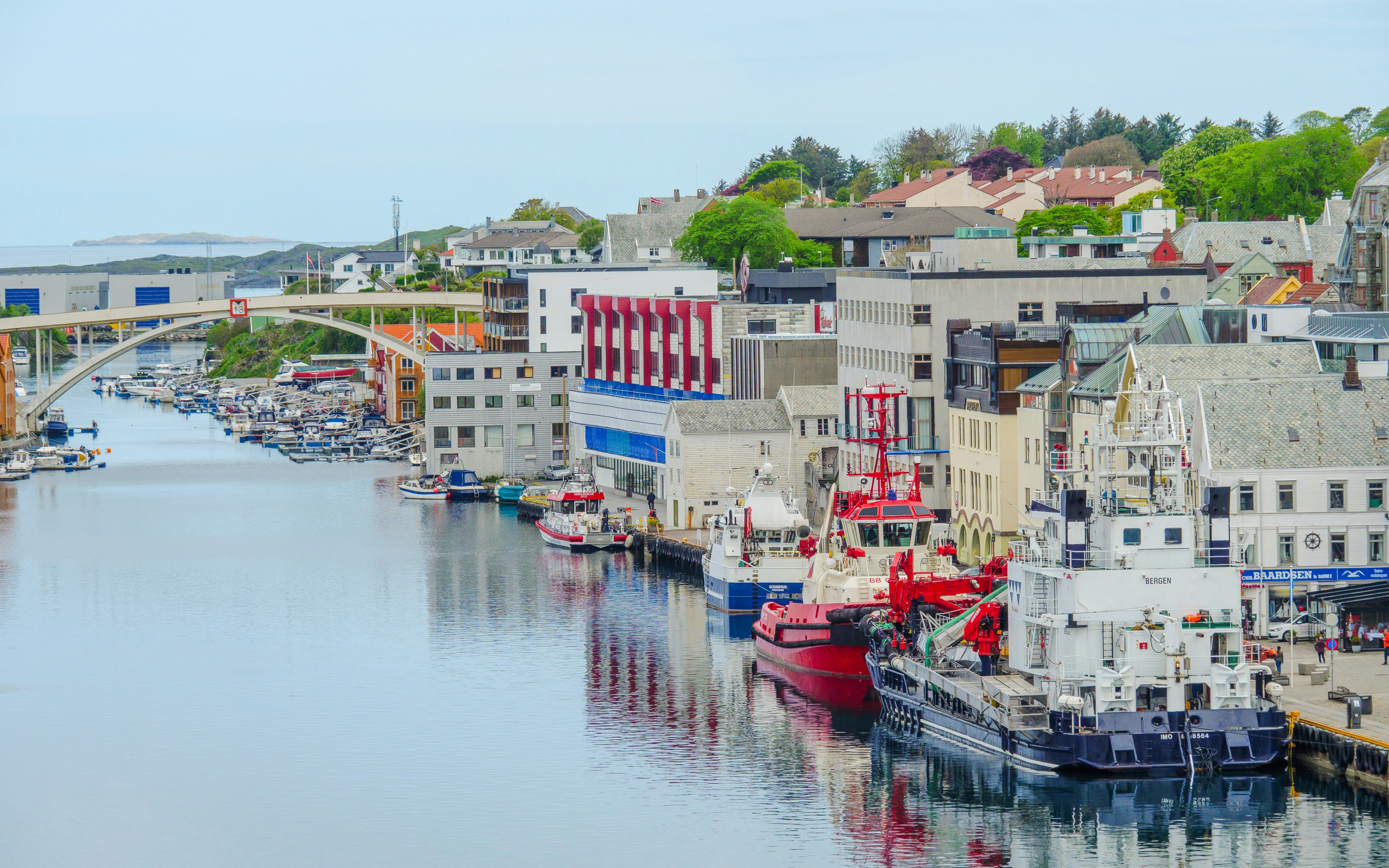 Haugesund port with docked cruise ships and waterfront buildings.