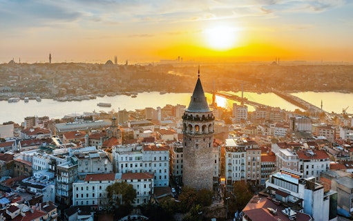 Aerial view of Galata Tower at sunset in Istanbul, Turkey.