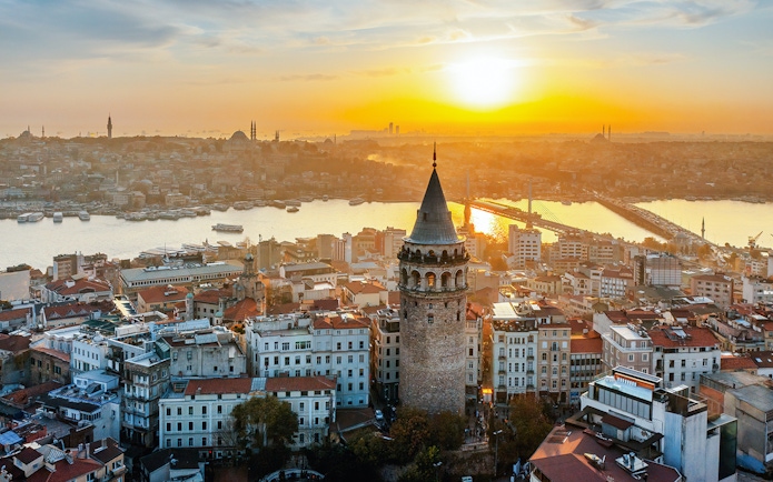 Aerial view of Galata Tower at sunset in Istanbul, Turkey.