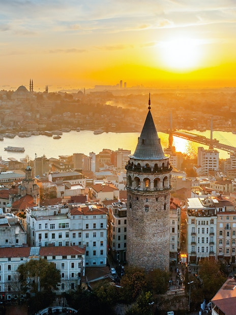 Aerial view of Galata Tower at sunset in Istanbul, Turkey.