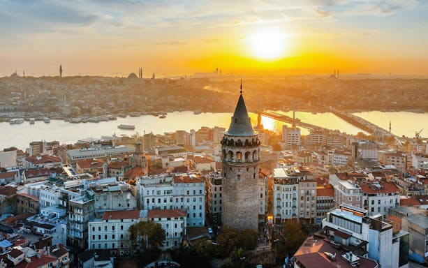 Aerial view of Galata Tower at sunset in Istanbul, Turkey.
