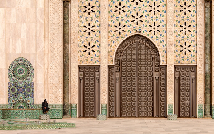 Hassan II Mosque ornate entrance with intricate tilework, Casablanca, Morocco.