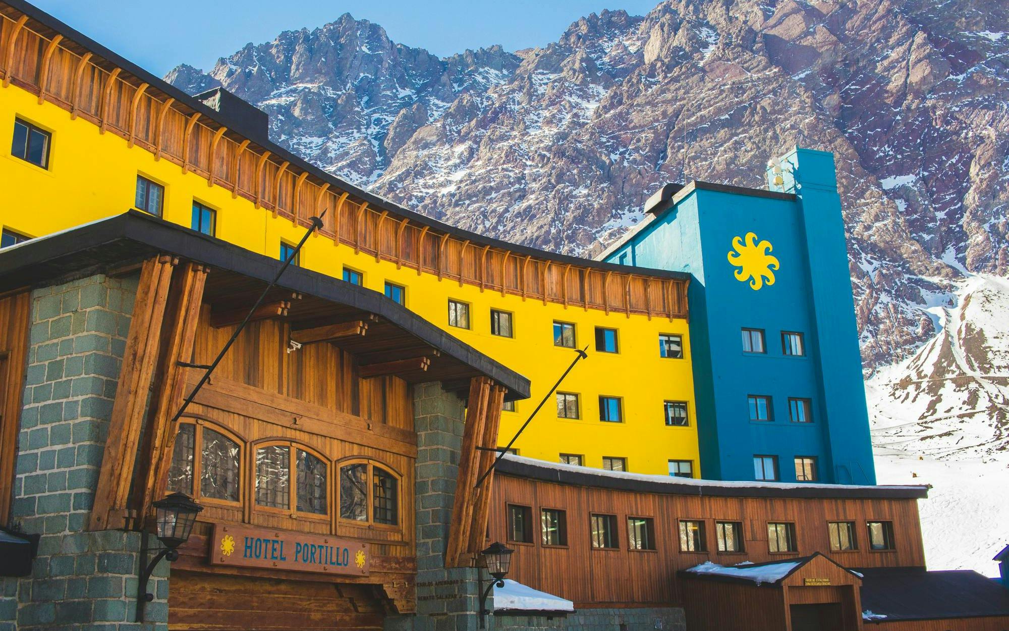 Yellow and blue Hotel Portillo in the Andes mountains, Chile.