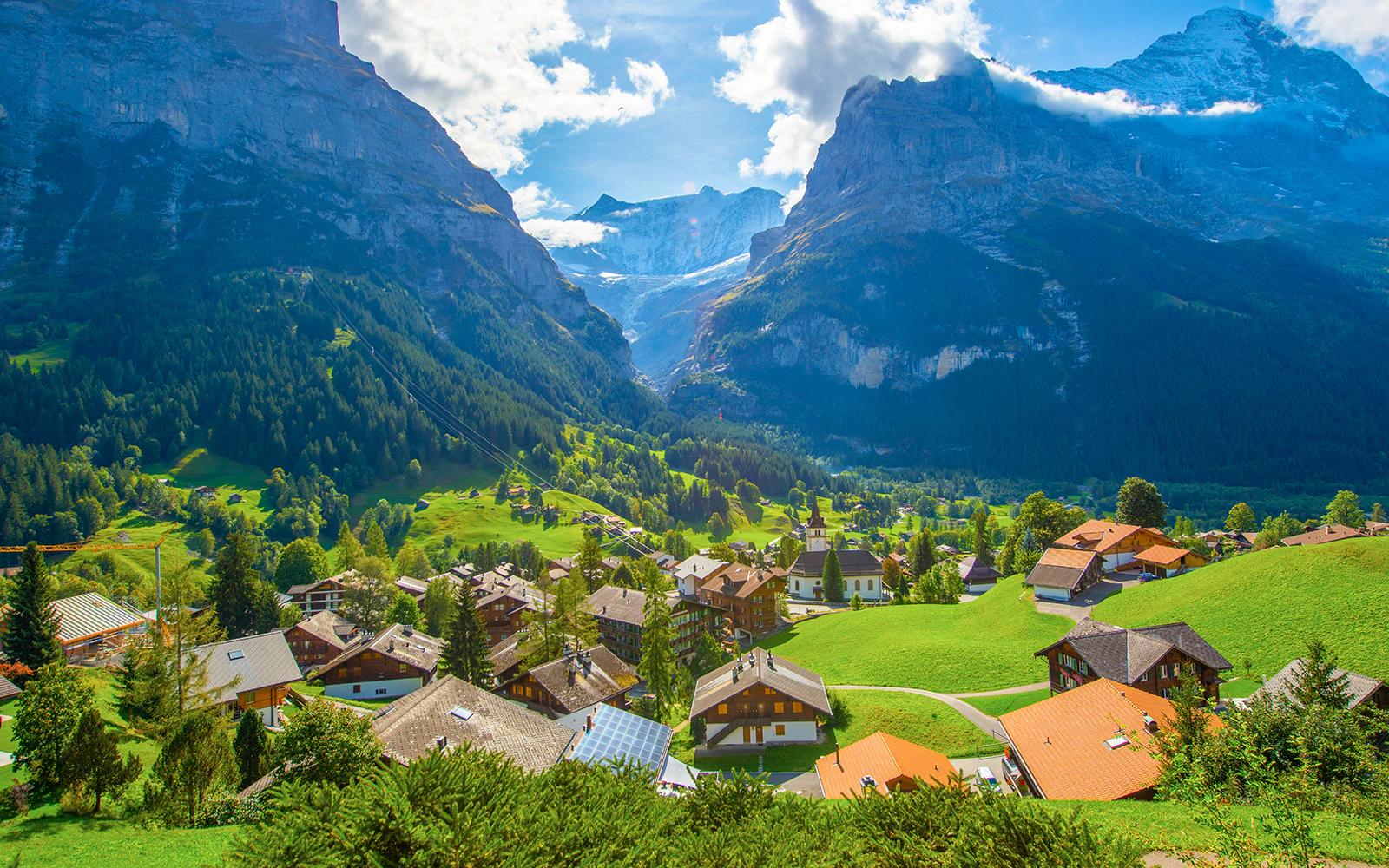 Village of Grindelwald with mountain backdrop, Jungfrau region, Switzerland.