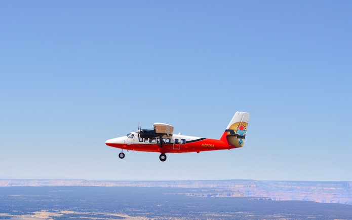 Small plane flying over the Grand Canyon, Arizona.