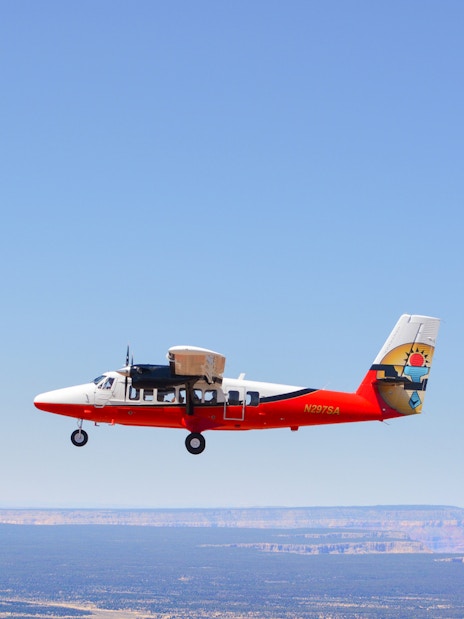 Small plane flying over the Grand Canyon, Arizona.