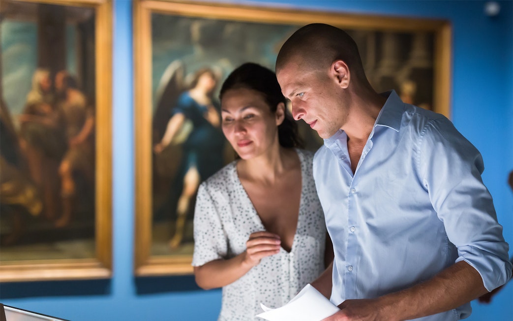 Visitors examining exhibits at The British Museum on a private tour in London.