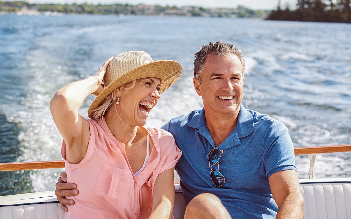Couple enjoying a boat ride on a Sunset Cruise in South Beach, Biscayne Bay.