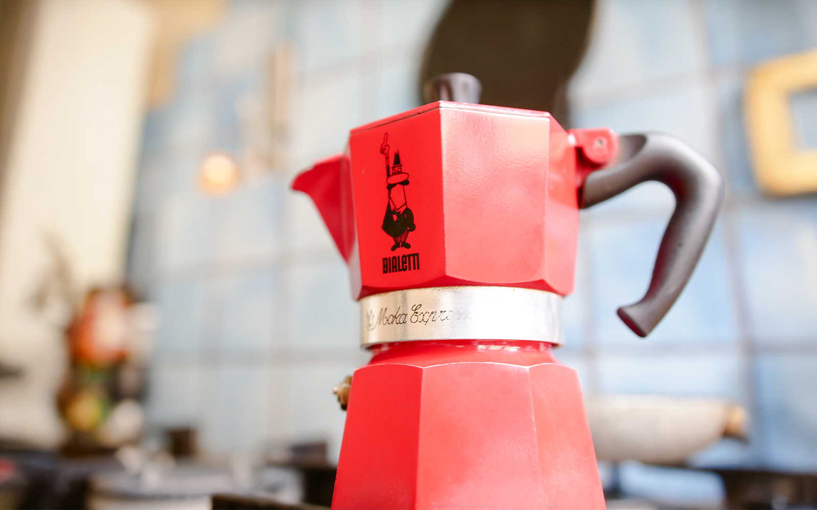 Red moka pot on a stove, Turin Hop-on Hop-off Bus Tour and Lavazza Museum experience.