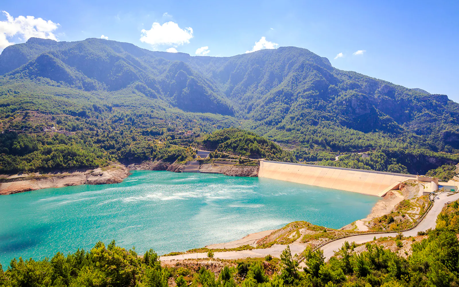 Oymapınar Dam with turquoise reservoir and surrounding mountains in Alanya, Turkey.