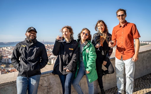 Group enjoying a view of Lisbon on a private electric tuk tuk tour.