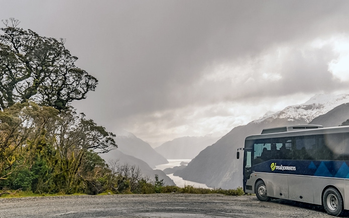 Cruise ship deck view of Doubtful Sound fjord, Te Anau overnight tour.