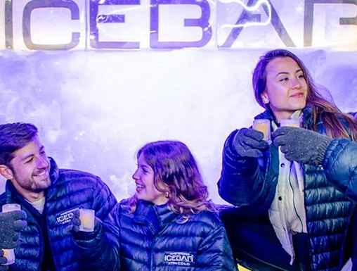 Visitors enjoying drinks at the Xtracold Icebar in Amsterdam.