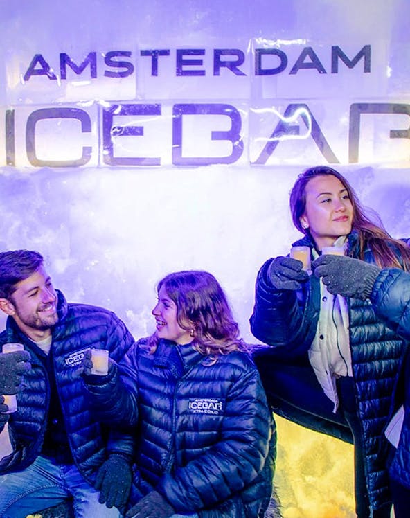 Visitors enjoying drinks at the Xtracold Icebar in Amsterdam.